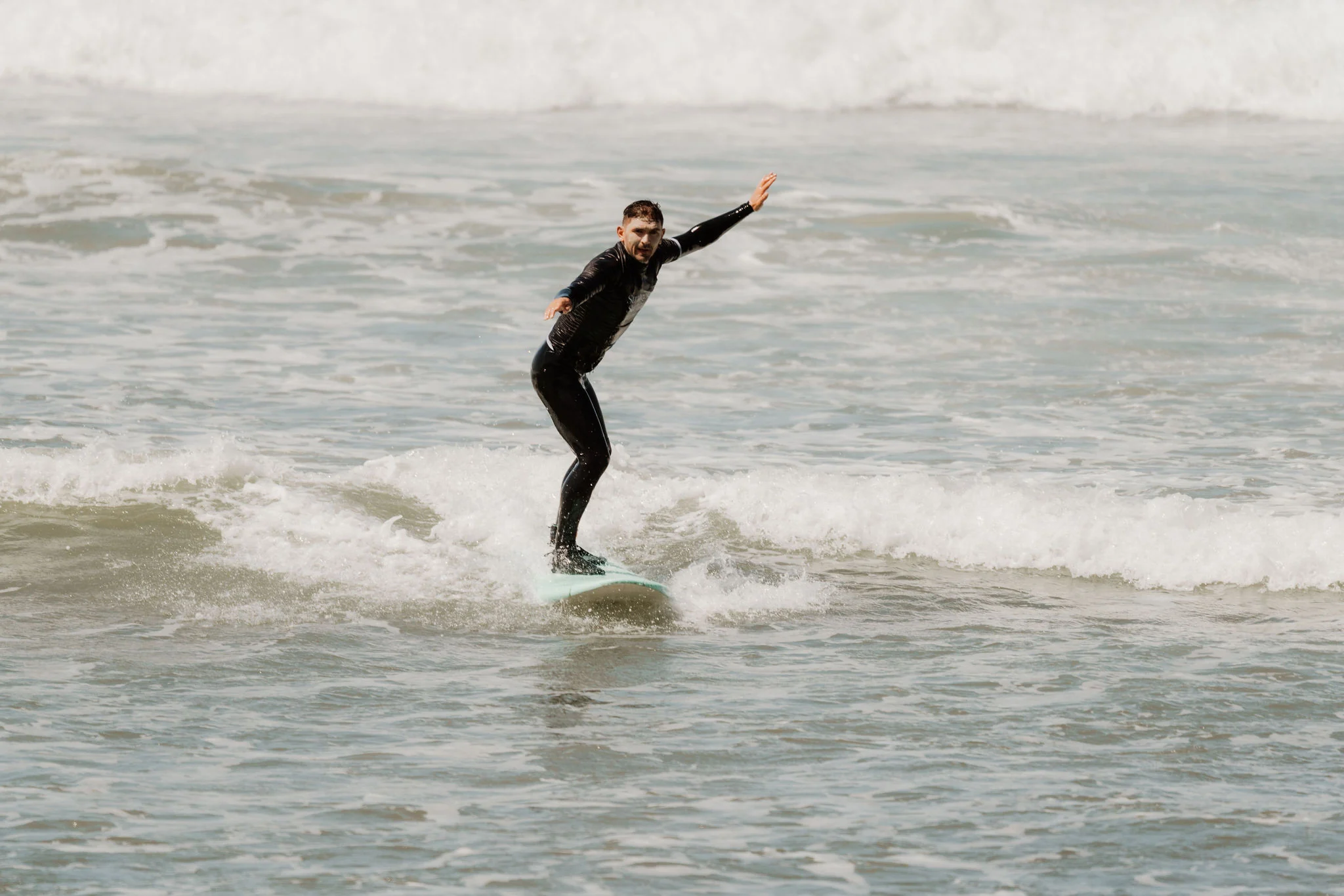 A Strategic Surfing participant riding a wave on the Ericeira coast